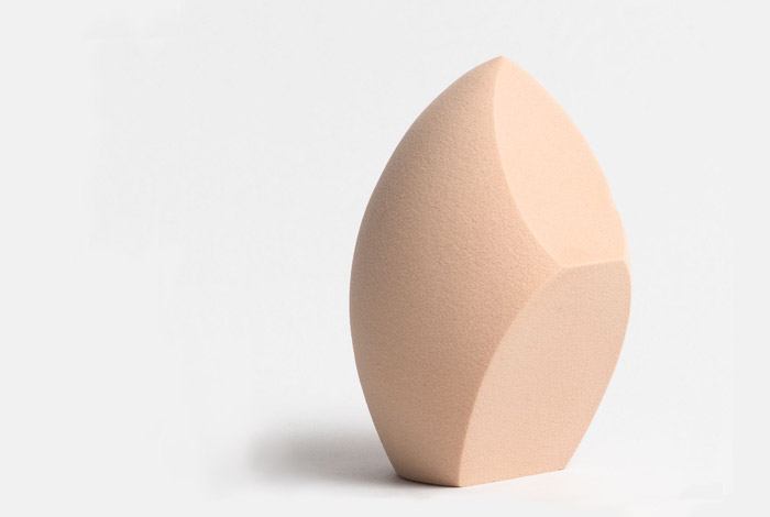Angled makeup blending sponge for men – beige sponge for smooth foundation application