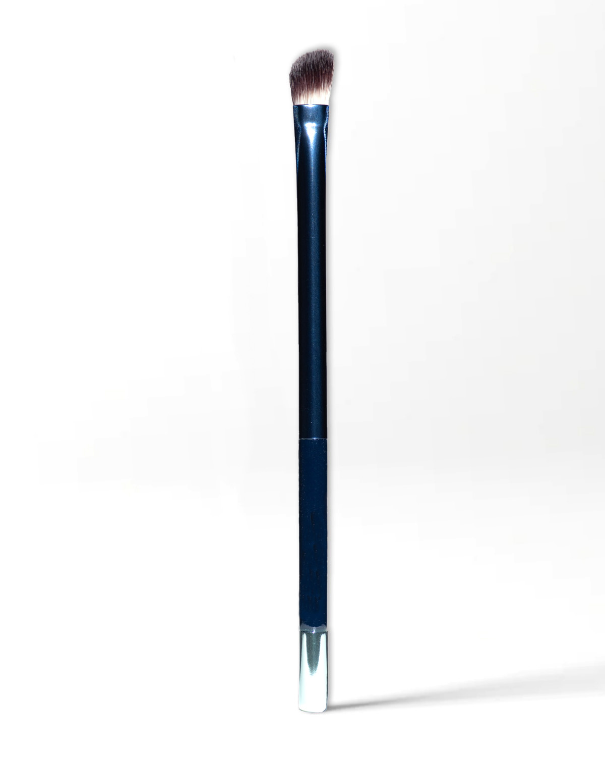 Angled micro fibre makeup brush for applying eyeshadows.